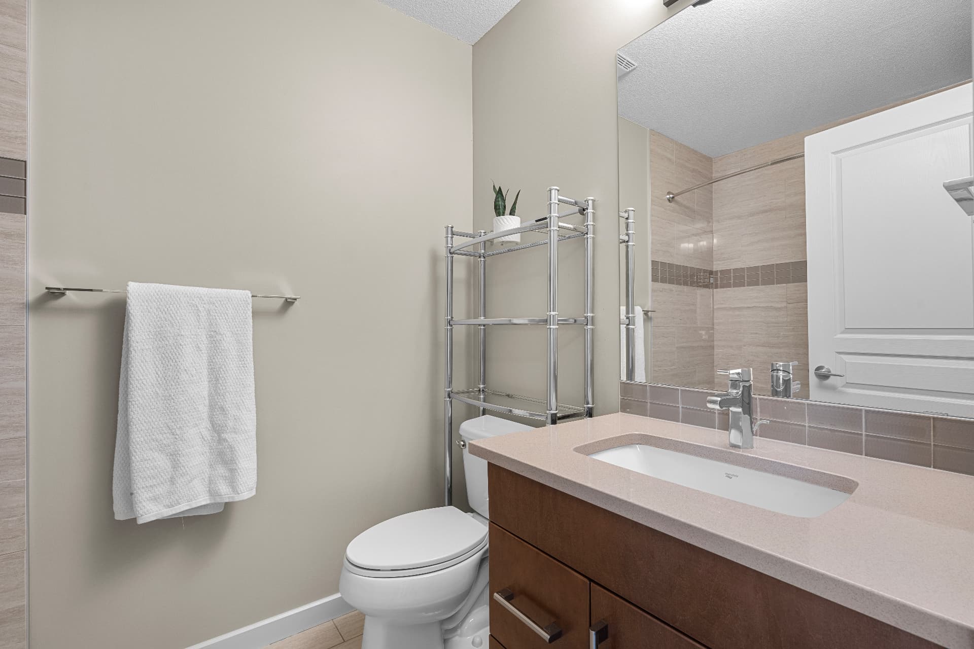 Bathroom with wood vanity and glass shower