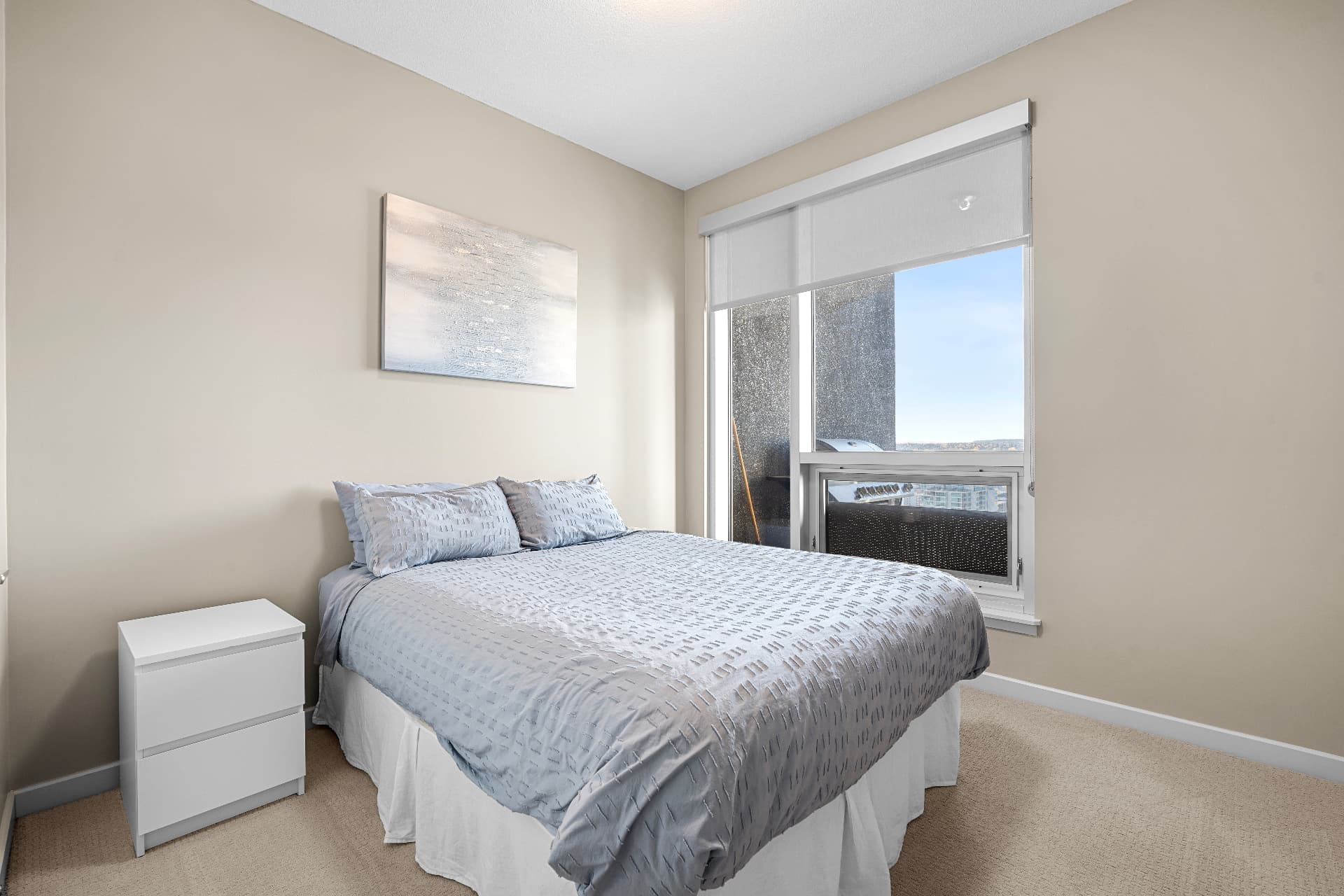 Second bedroom with window and nightstand