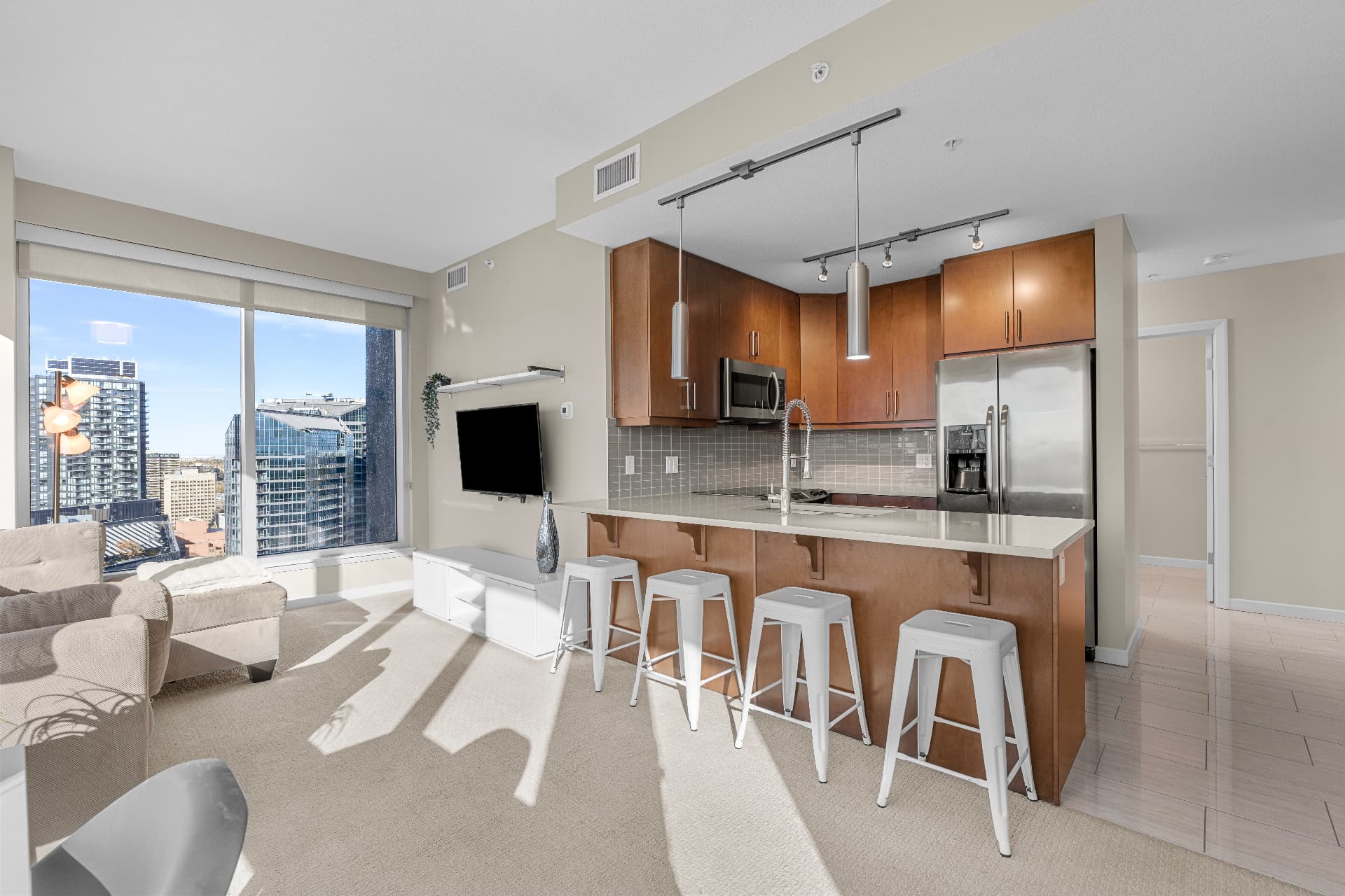 Open-concept living room with floor-to-ceiling corner windows